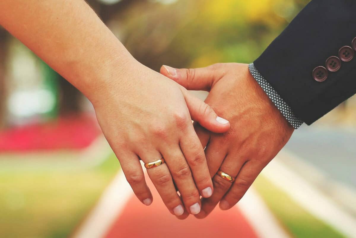 Married couple's hands with rings